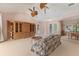 Bright living room with vaulted ceilings, a ceiling fan, and large windows at 4356 Highland Oaks Cir # 3, Sarasota, FL 34235