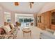 Spacious living room with sliding glass doors, and carpeted floor at 4356 Highland Oaks Cir # 3, Sarasota, FL 34235