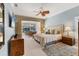 Well-lit main bedroom featuring access to the outside patio and a ceiling fan at 4356 Highland Oaks Cir # 3, Sarasota, FL 34235