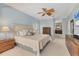Spacious bedroom with light blue walls, a ceiling fan, and carpeted floors at 4356 Highland Oaks Cir # 3, Sarasota, FL 34235