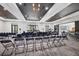 Modern meeting room with black folding chairs, elegant lighting, and lots of natural light at 4356 Highland Oaks Cir # 3, Sarasota, FL 34235