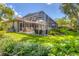 Beautiful screened-in pool and patio area, surrounded by a lush green lawn at 4356 Highland Oaks Cir # 3, Sarasota, FL 34235