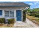 Unit featuring a blue front door and landscaped pathway at 4444 Swift Rd # 25, Sarasota, FL 34231