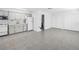 Bright and open kitchen area with a white refrigerator and neutral finishes at 4444 Swift Rd # 25, Sarasota, FL 34231