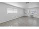Bright living room featuring tile flooring and natural light from multiple windows at 4444 Swift Rd # 25, Sarasota, FL 34231