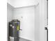 Storage closet featuring a hot water heater at 4444 Swift Rd # 25, Sarasota, FL 34231