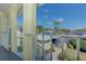 Balcony view showcasing the well-maintained landscaping and community parking at 446 Cerromar Rd # 291, Venice, FL 34293