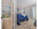 Bright bedroom connecting to the en-suite bathroom, featuring a large bed and access to a balcony at 446 Cerromar Rd # 291, Venice, FL 34293