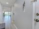 Clean and inviting entryway with modern gray walls and views of living space, providing a warm welcome at 446 Cerromar Rd # 291, Venice, FL 34293