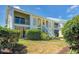 Inviting condo building with mature trees, and ample green space at 446 Cerromar Rd # 291, Venice, FL 34293