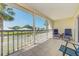 Screened lanai with water views, lovely landscaping, and comfortable seating provides peaceful outdoor relaxation at 446 Cerromar Rd # 291, Venice, FL 34293