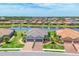 Aerial view of home with lake view in a beautiful community at 4750 Tortona Ct, Bradenton, FL 34211