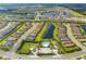 Aerial view of a community with a lake and a pool at 4750 Tortona Ct, Bradenton, FL 34211