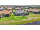 Backyard aerial view showcases the lawn, patio, and screened in lanai at 4750 Tortona Ct, Bradenton, FL 34211