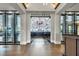Inviting Barrel House entrance featuring wine displays and glimpse of the bar area with stylish herringbone floors at 4750 Tortona Ct, Bradenton, FL 34211