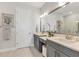 Bathroom features dual vanities, large mirror, modern lighting and a walk-in shower at 4750 Tortona Ct, Bradenton, FL 34211