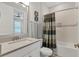 Well-lit bathroom featuring a vanity, decorative mirror, bathtub, and a shower with tasteful accents at 4750 Tortona Ct, Bradenton, FL 34211
