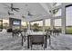 Inviting dining area with comfortable seating, a cozy fireplace, and scenic views of the golf course at 4750 Tortona Ct, Bradenton, FL 34211
