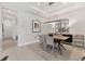 Dining room featuring modern lighting fixture, table with seating for four and decorative mirror at 4750 Tortona Ct, Bradenton, FL 34211