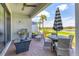 Outdoor patio with scenic water views, a shaded seating area, grill, and comfortable lounge furniture at 4750 Tortona Ct, Bradenton, FL 34211