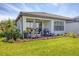 Covered patio featuring outdoor dining and BBQ, perfect for entertaining at 4750 Tortona Ct, Bradenton, FL 34211