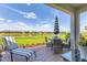 Relaxing outdoor patio overlooking a serene lake with comfortable seating and a peaceful atmosphere at 4750 Tortona Ct, Bradenton, FL 34211