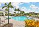 Resort-style pool area with lounge chairs, lush landscaping, and a gazebo for relaxing in a beautiful community at 4750 Tortona Ct, Bradenton, FL 34211