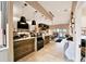Charming restaurant featuring a service counter, pendant lighting, and outdoor patio access, offering an inviting dining atmosphere at 4750 Tortona Ct, Bradenton, FL 34211