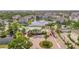 Aerial view of the community showcasing the pool, pond, and nearby buildings at 4802 51St W St # 107, Bradenton, FL 34210