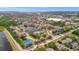 Expansive aerial view of the community highlighting the pond, amenities and landscape at 4802 51St W St # 107, Bradenton, FL 34210