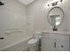 Well-lit bathroom features a tub with tile surround, updated vanity, and modern fixtures and bronze-colored hardware at 4802 51St W St # 107, Bradenton, FL 34210