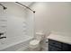 Bathroom featuring white tiling with black fixtures at 4802 51St W St # 107, Bradenton, FL 34210
