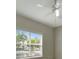 Bright bedroom featuring a ceiling fan, and a large window offering natural light at 4802 51St W St # 107, Bradenton, FL 34210
