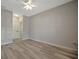 Bright bedroom with wood-look floors, a ceiling fan and two doors at 4802 51St W St # 107, Bradenton, FL 34210