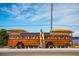 Repurposed bus for recreation with surfboards, paddles, and a person with a surfboard at 4802 51St W St # 107, Bradenton, FL 34210
