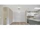 Bright dining area featuring stylish wood-look floors and shiplap accent wall at 4802 51St W St # 107, Bradenton, FL 34210