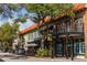 Downtown street scene with sidewalks, dining areas and commercial buildings in a bustling urban setting at 4802 51St W St # 107, Bradenton, FL 34210