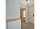 Welcoming entryway with light wood flooring and a modern accent wall detail at 4802 51St W St # 107, Bradenton, FL 34210