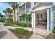 Charming condo exterior featuring a walkway, stairs, and well-maintained landscaping at 4802 51St W St # 107, Bradenton, FL 34210