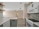 Eat-in kitchen featuring stainless steel appliances and bar seating at 4802 51St W St # 107, Bradenton, FL 34210