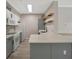 Bright kitchen featuring an island with a quartz countertop and stainless steel appliances at 4802 51St W St # 107, Bradenton, FL 34210