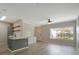Bright and airy living room featuring modern finishes, wood-look floors, and natural light at 4802 51St W St # 107, Bradenton, FL 34210