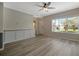 Bright living area featuring wood-look floors, neutral paint, and a large window at 4802 51St W St # 107, Bradenton, FL 34210