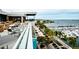 Outdoor seating area overlooking marina with distant water views, perfect for dining and relaxation at 4802 51St W St # 107, Bradenton, FL 34210