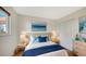 Cozy bedroom with ample natural light, ocean-themed decor, and closet at 4968 Gulf Of Mexico Dr # Villa 22, Longboat Key, FL 34228