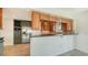 Open kitchen features granite countertops, stainless steel appliances, and custom wood cabinetry at 4968 Gulf Of Mexico Dr # Villa 22, Longboat Key, FL 34228