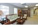 Cozy library with comfortable seating and extensive bookshelves, creating a relaxing reading environment at 4968 Gulf Of Mexico Dr # Villa 22, Longboat Key, FL 34228
