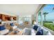 Inviting living area showcasing updated kitchen and dining space with sweeping waterfront views at 4968 Gulf Of Mexico Dr # Villa 22, Longboat Key, FL 34228