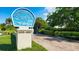 Windward Bay community sign with well-maintained landscaping and entrance at 4968 Gulf Of Mexico Dr # Villa 22, Longboat Key, FL 34228