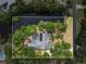 Overhead aerial view of home with a pool, waterfront and view of the neighborhood at 5282 Box Turtle Cir, Sarasota, FL 34232